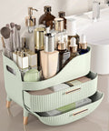 Slick Green Makeup Organizer With Two Deep Drawers And Sturdy Carry Handle, Large Skincare Storage Box For Vanity Tops filled with cosmetics.