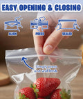 Hand sealing Clear 2x2 Inch Resealable Zip Top Plastic Bags 1000 Pack With Zipper Seal For Jewelry Beads Small Parts Crafts And Hardware Storage - Food Grade Safe, FDA Compliant with strawberries inside.