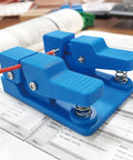 Super Cool Qinkyh Welding Wire Fixture And Soldering Table Clamp That Lets You Handle Any Diameter From 0.3 To 8mm With Ease on a desk.