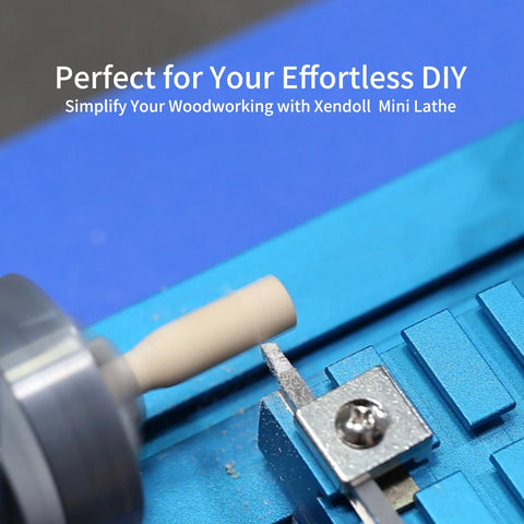 Blue mini metal lathe on a benchtop, close-up of turning a wooden dowel for hobby use
