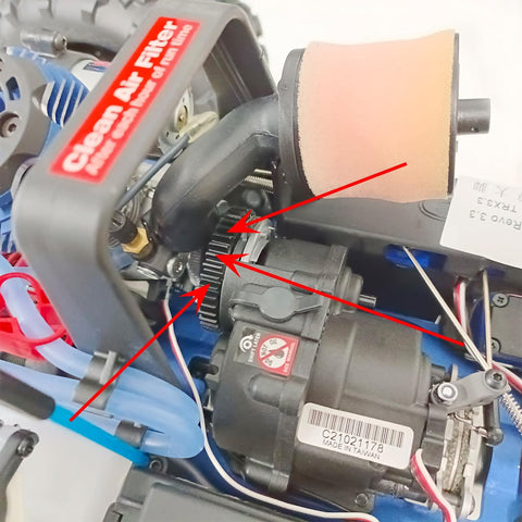 Close-up of carbon steel main spur gear set for one eighth scale RC Revo, showing installation and connection details.