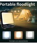 JUDYSSY New Led Floodlight Three-Color Light Adjustable Brightness Spotlight Portable Detachable Wire IP 66 Waterproof Lamp for Court,Garden,Warehouse,Changeable100W，Ch，Changeable-100W in outdoor setting with tents.