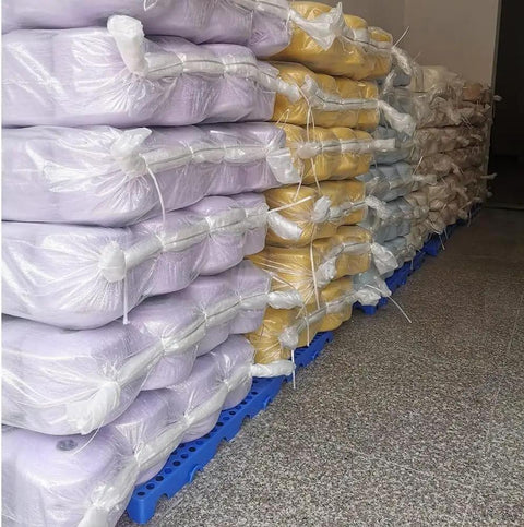 Stacked bags on Lightweight Interlocking Plastic Pallet With Breathable Grid Design 60x30x3 Cm Blue For Garage Warehouse Store Storage
