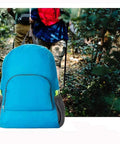 Lightweight 20L Waterproof Hiking Backpack With Multiple Pockets in a forest setting, foldable travel daypack for outdoor adventures.