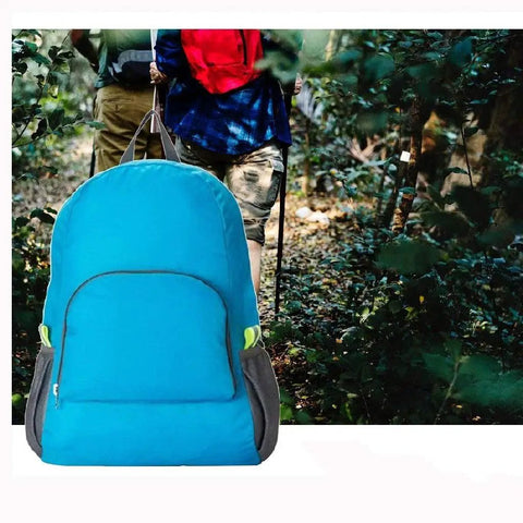 Lightweight 20L Waterproof Hiking Backpack With Multiple Pockets in a forest setting, foldable travel daypack for outdoor adventures.