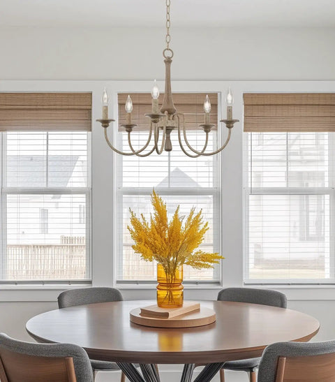 24-Inch Five-Light French Country Chandelier With Adjustable Height In Smoked Birch And Black Finish hanging over dining table.