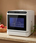 Portable Countertop Dishwasher High Temp Wash And Air Dry Dual Spray Arm on kitchen counter with apples and plant
