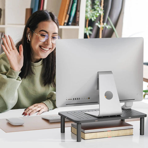 Go To Adjustable Desk Monitor Stand With Laptop Riser And Under Desk Storage in use with computer monitor, black metal frame.