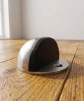 Stainless Steel Adhesive Door Stop Half Dome Floor Bumper on wooden floor, corrosion resistant, for office and home use