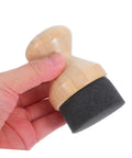 Real Deal Silicone Cutting Board Oil Wax Applicator Brush For Zero Hassle Kitchen Maintenance And Wooden Utensil Care Food Grade Mineral Oil Finishing Tool Smooth Operator No Rush Setup held in hand, showing wooden handle and black sponge tip.