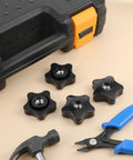 Heavy Duty 5/16 Black Star Knobs With Female Thread 4 Pack Ergonomic Wing Nuts for Shop and Garage, set on a workbench.