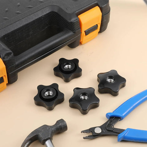 Heavy Duty 5/16 Black Star Knobs With Female Thread 4 Pack Ergonomic Wing Nuts for Shop and Garage, set on a workbench.