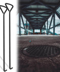Two Piece 80 Centimeters Manhole Hook Lifter Set next to manhole cover on pavement.
