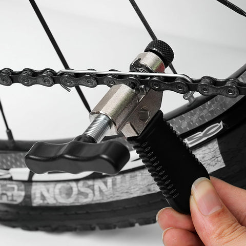 Close-up of Bike Chain Repair Tool Set With Chain Breaker Splitter For Easy Quick Fix On The Go Premium Hardened Steel Chain Tool in use
