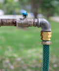 Connected garden hose with Garden Hose Repair Kit With Clamps Six Piece Set Male And Female Connectors For Three Quarter Inch Or Five Eighth Inch Hoses Aluminum Body With Copper Finish And Stainless Steel Clamps No Fuss Leak Fix And Quick Connect in outdoor setting.