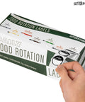 Hand holding box of Removable 1 Inch Day Of The Week Date Dots For Food Storage Meal Prep Labels In A Dispenser Box 7000 Food Container Labels