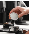 Premium Double Layer Reusable Espresso Shower Screen Filter For 51mm Portafilter Plus 304 Stainless Steel Bottomless Filter Kit in hand