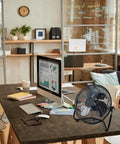 12-Inch Cradle Floor Fan With 3-Speed High-Velocity Airflow, 180-Degree Tilt, All-Metal Build, Black, on office desk