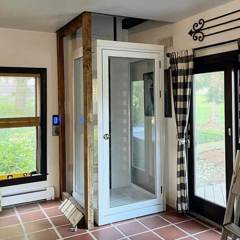 Through Ceiling Compact Home Elevator Shaftless Design For Space Saving Living With Zero Wall Damage Heritage Approved, Customizable Configurations For Homes Farms And Land Projects, Easy Install And Quiet Deck Lift For Modern Homes in white glass