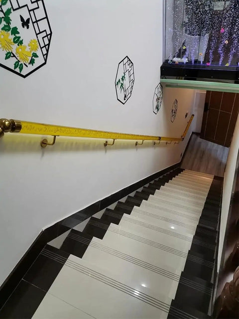 Clear Acrylic Wall Mount Handrail With Gold Brackets Rock Solid Non Slip Stairway Support Banister Hella Durable Indoor Exterior Grab Bar For Family Safety Smooth Finish Design along black and white staircase.