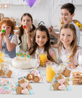 Kids celebrating a birthday with Clear Cellophane Treat Bags 5x7 Inches, 100 Pack With Gold 3 Inch Twist Ties filled with cookies.