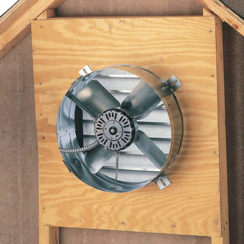 Gable mount attic ventilator with 14 inch blade and 2.6 amp motor, installed on wooden gable for up to 1850 sq ft