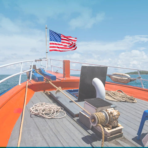 Stainless Steel Rail Mount Flag Staff Pole With Adjustable Clamps And 12x18 Inch US Flag, 15 3/16 Inch Length on boat deck.