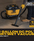 Kickass Cordless Wet Dry Shop Vacuum With Sick Suction And Six Gallon Tank For Jobsite Garage Cleanup Grab And Go Portable Rig With Built In Storage And Fast Blower Toggle Tool Only, 6-gallon vacuum being used on a floor.