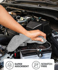 Grey microfiber cleaning cloth, close-up view, used on car engine bay; 12x12 inch, reusable, scratch-free
