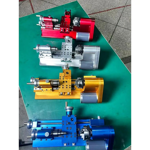Compact Mini Metal Lathe For Benchtop Use With 3 Jaw Chuck And Tailstock in red, yellow, blue, and silver colors on a green surface.