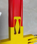 Close-up of Ultimate Cross Shape Racetrack Connector Kit For Hot Wheels Fans with red and yellow plastic intersection