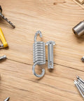 Heavy Duty Hanging Chair Spring Pin Kit With Precision Spring Steel Quick Install And Movement Reduction For Balcony Outdoor Hammocks 2 Pack Set For Smooth Swings And Long Lasting Durability spring hook and pin on wood surface