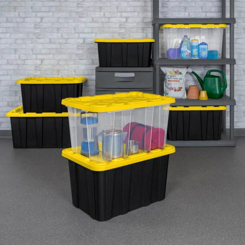 4 Pack 27 Gallon Heavy Duty Industrial Storage Tote with Lids, black and yellow bins stacked in garage setting with visible contents