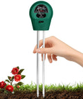 Hand holds 3 In 1 Soil Moisture Light And pH Tester Battery Free Gardening Tool for indoor and outdoor use above soil with roses.