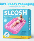 Box of Inflatable Tanning Pool Lounger With Pillow 70 By 46 Inches Personal Water Filled Float For Backyard Chill in pink.