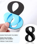 Close-up of removing adhesive backing from number 8 in 10 Pack Self Adhesive House Numbers 0 To 9 Black 4 By 2.5 Inch Vinyl