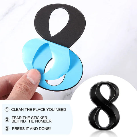Close-up of removing adhesive backing from number 8 in 10 Pack Self Adhesive House Numbers 0 To 9 Black 4 By 2.5 Inch Vinyl