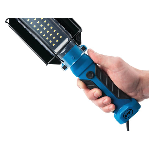 Close-up of a hand holding a 1000 Lumen LED Drop Light With Built In 120V Outlet, showing the rugged handle and LED panel.
