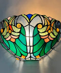 Soft Glow Tiffany Style Wall Sconce In Sea Green Stained Glass With One Light Vintage Victorian Ambience For Living Room Bedroom Hallway And Entryway Classic Cool Vibe For Cozy Homes, displaying ornate sea green and multicolor stained glass pattern