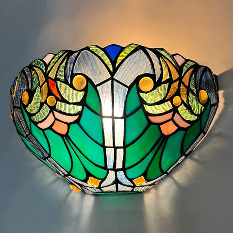 Soft Glow Tiffany Style Wall Sconce In Sea Green Stained Glass With One Light Vintage Victorian Ambience For Living Room Bedroom Hallway And Entryway Classic Cool Vibe For Cozy Homes, displaying ornate sea green and multicolor stained glass pattern