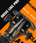 Top view of McLaren Licensed 48V Electric Go Kart for Teens 14 Plus with pedals and steering wheel shown, black and orange design