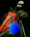 Portable Pop Up Golf Chipping Net With Carry Bag For Indoor And Outdoor Practice hanging on a golf bag with clubs.