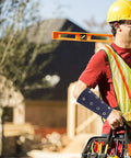 Man wearing Lightweight Cut Resistant Wrist Guards With Breathable Mesh Sleeves For Mechanics And Yard Work on construction site.