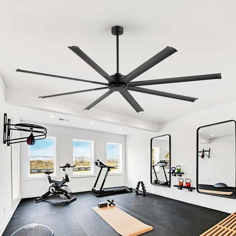84 Inch Solid As A Rock Industrial Ceiling Fan With No Sweat Remote Setup And Eight Durable Aluminum Blades in a gym setting.