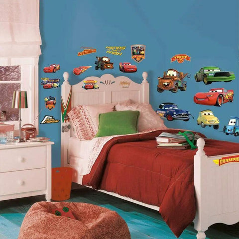 Disney Pixar Cars Piston Cup Champs Peel And Stick Wall Decals on a blue wall in a child's bedroom with white furniture