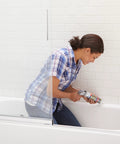 Person using Advanced Silicone Kitchen And Bath Sealant In Almond Color For Easy DIY No Mess Caulking In Kitchens And Bathrooms Two Point Eight Ounce Tube Made In USA Durable Long Lasting Grout Line Edge Sealant on bathtub