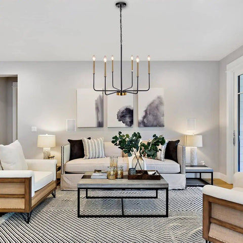 Six Light Farmhouse Chandelier With Adjustable Height Black And Gold Iron Pendant Lighting For Dining Room Kitchen Island Living Room And Foyer Clean Modern Candle Style That Delivers Classic Charm And Everyday Boss Vibe in a modern living room.