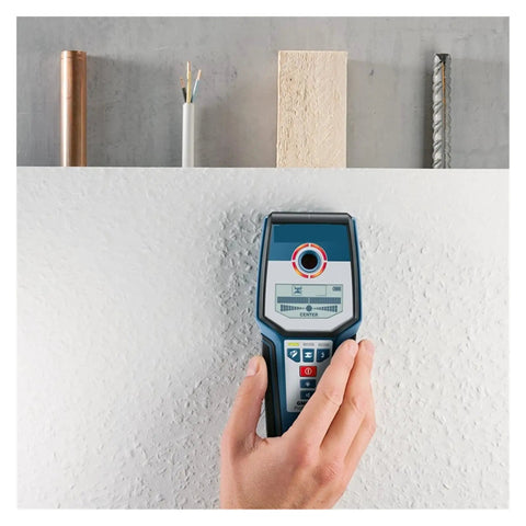 Professional Stud Finder Wall Scanner With Automatic Calibration To Nail Your Drywall Projects And Locate Rebar Pipes Plus Live Wires Using Hella Reliable Detection, being used on textured drywall surface.