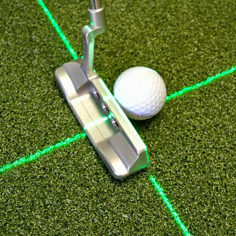 Solid Side Laser Putting Trainer For Righty Golfers Groove Plus Alignment Tool on practice green with white golf ball.
