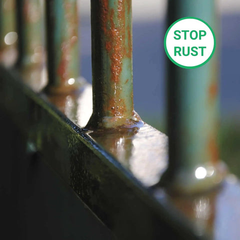 Close-up of rusted metal bars with a 'stop rust' symbol, illustrating use of All In One Heavy Duty Rust Inhibitor For Metal And Wood And Paint Conditioner 34 Oz Prevents Corrosion Improves Paint Flow And Adhesion Smooth Application Heat Resistant Protection For Metal Machinery And Industrial Equipment.